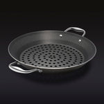 The HexClad 12&quot Hybrid BBQ Grill Pan on a black background